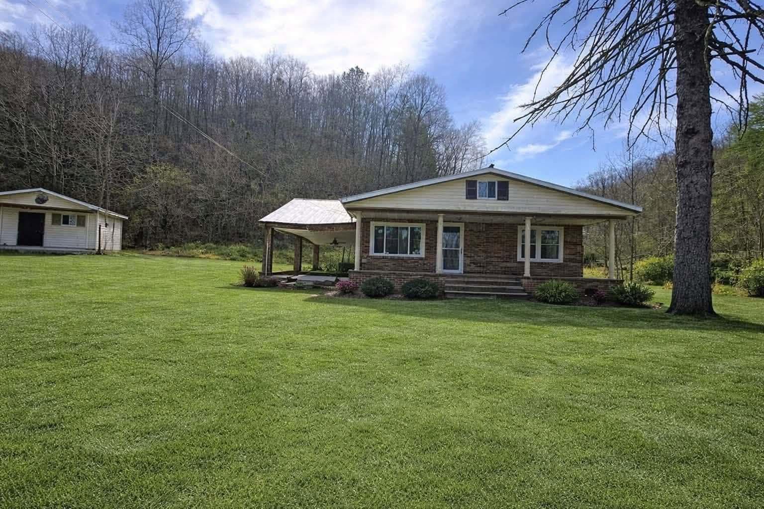 Affordable Brick Home on Nearly 7 Acres Featuring Creek Frontage and Flexible Financing Opportunity