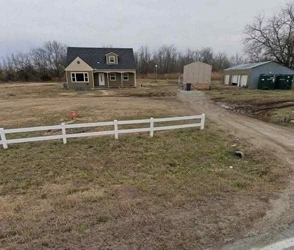 Spacious 4-Bedroom Home with Acreage and Garage in Augusta, Kansas